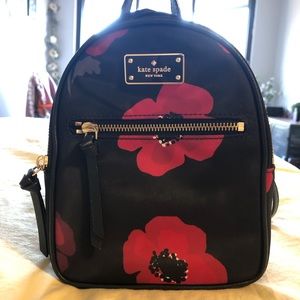 Red and black floral bag made by Kate Spade.